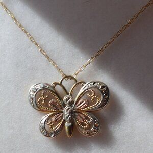 Coleman Company 10k. solid gold with 12k. black hills gold butterfly necklace